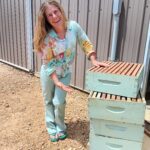 women beekeeper with hives