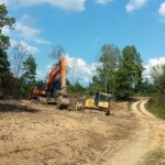 Track Hoe And Bulldozer